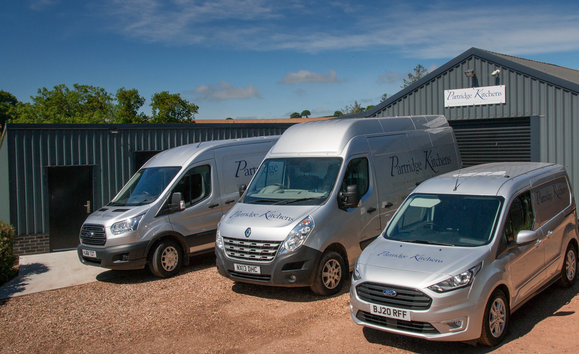 Our three vans outside the Partridge Kitchens workshop